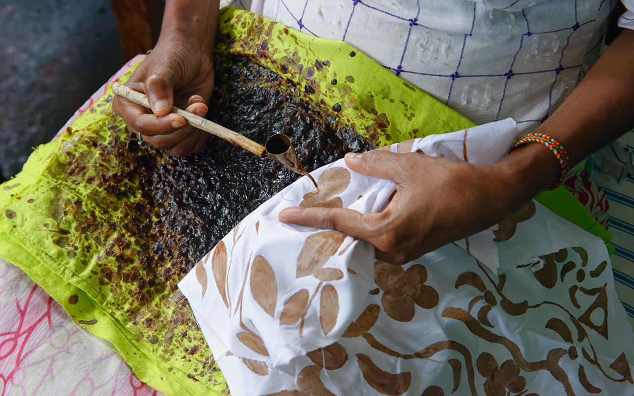 Woman applying the wax to create the design at the Kandy batik factory