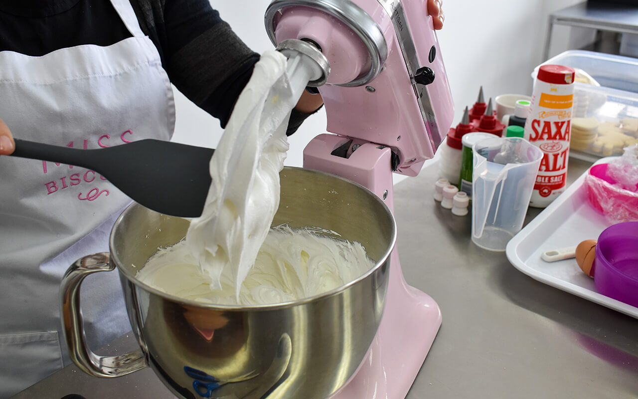 Miss Biscuit mixing the royal icing in her fine mixer