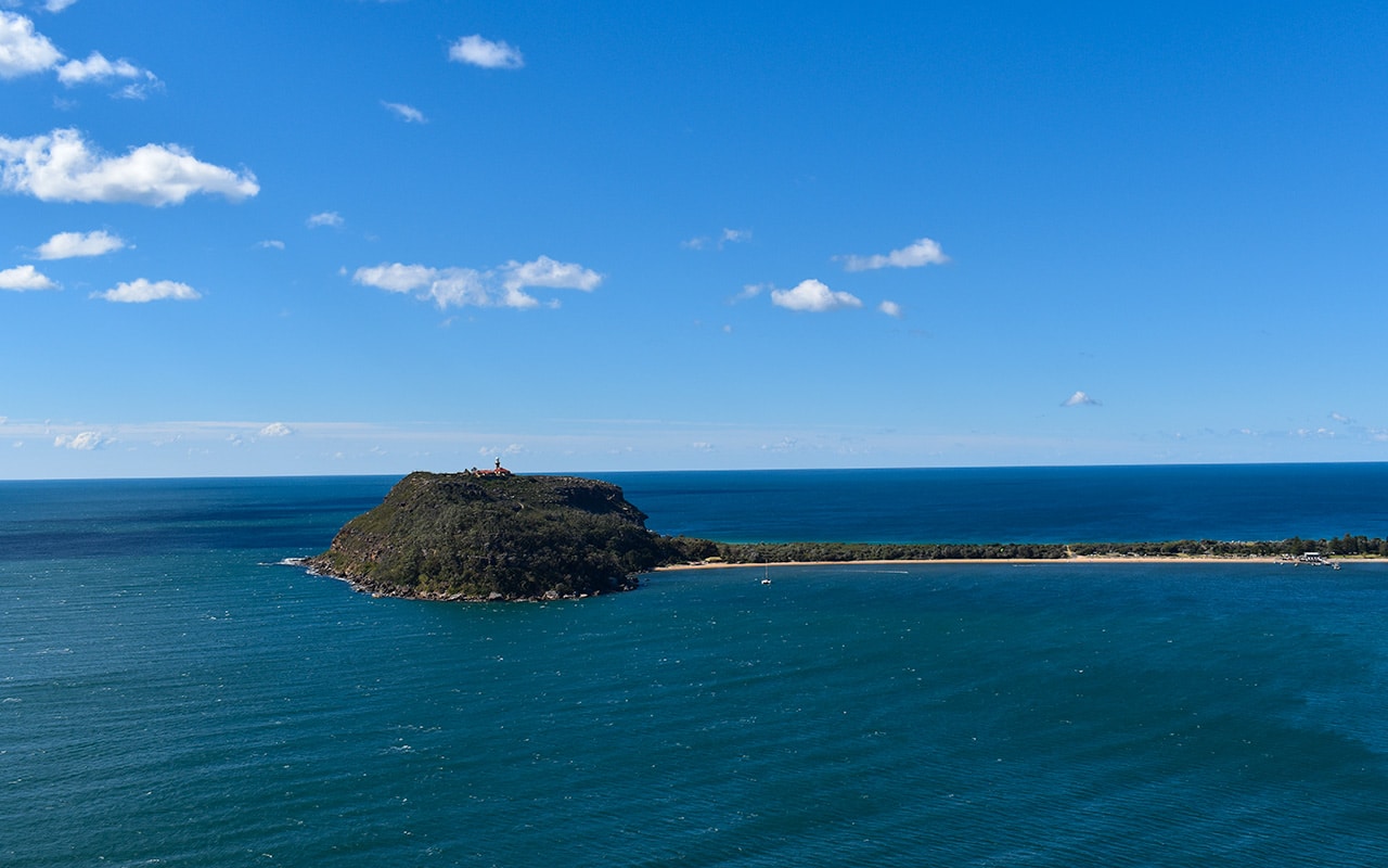 From West Head Lookout, Barrenjoey Lighthouse seems a little lonely in the big blue ocean