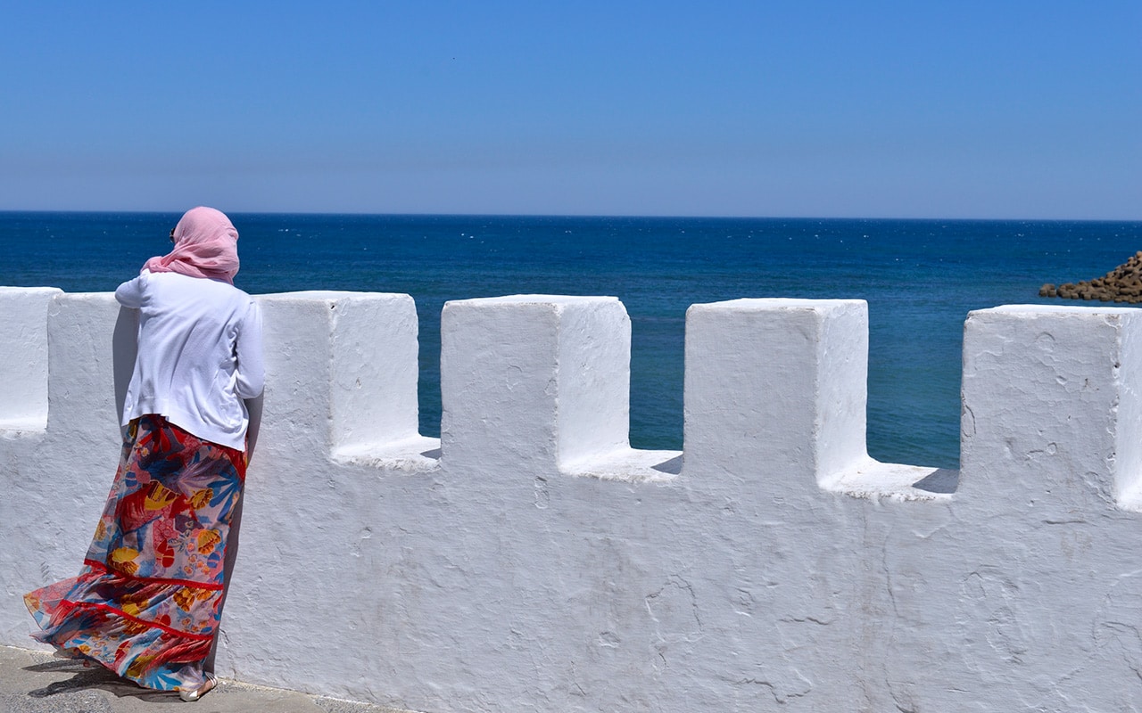 Moroccan woman on the Asilah ramparts