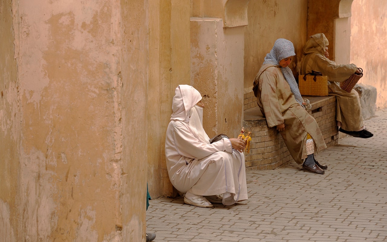 Women taking a break after a day haggling in Morocco markets