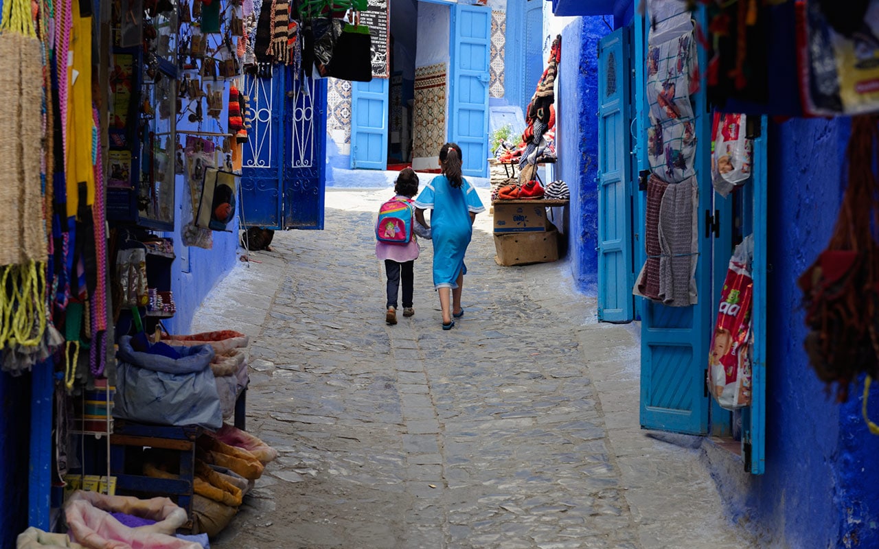 The blue streets of Chefchaouen are full of real life and children