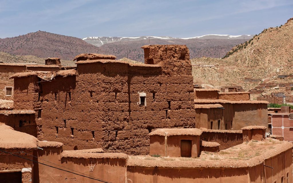 You can see adobe houses on a Marrakech day tour
