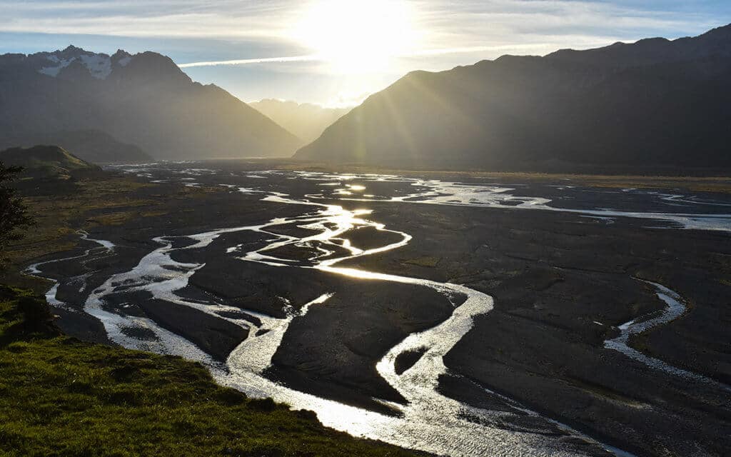 Watch the braids of the Rakaia River at sunset