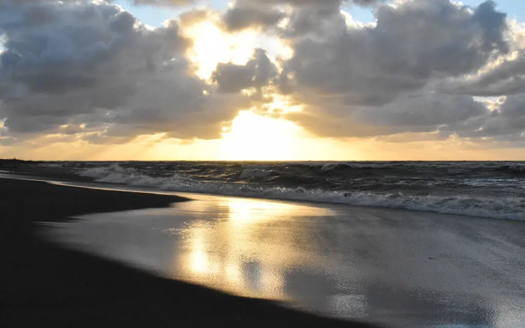 The West Coast of New Zealand looks peaceful at sunset