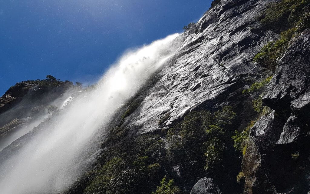 Experience a waterfall up close in Milford Sound