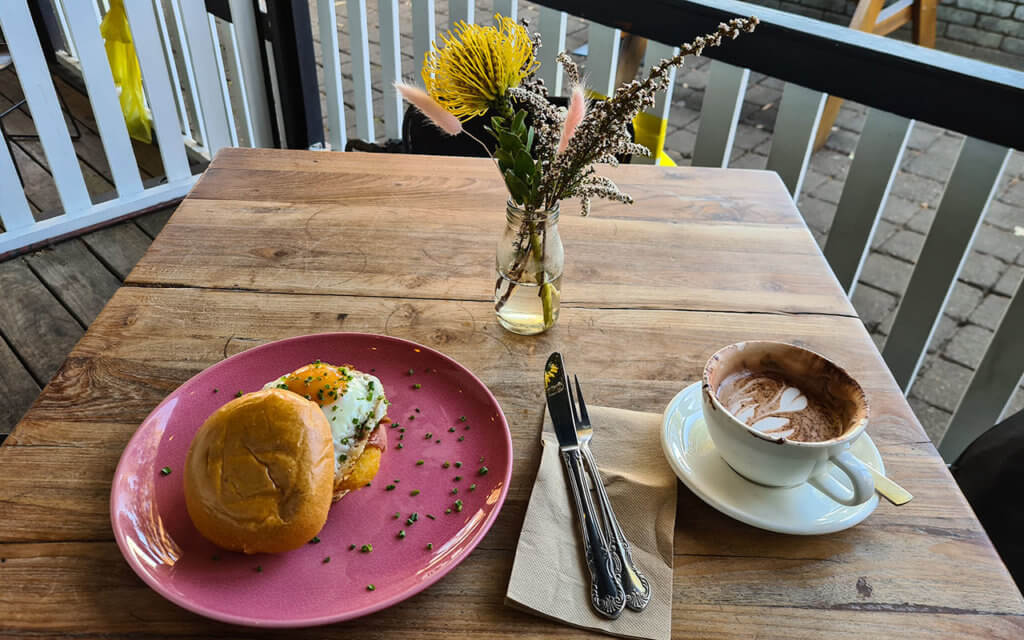 Enjoy a well deserve breakfast at a cafe in Collins Street